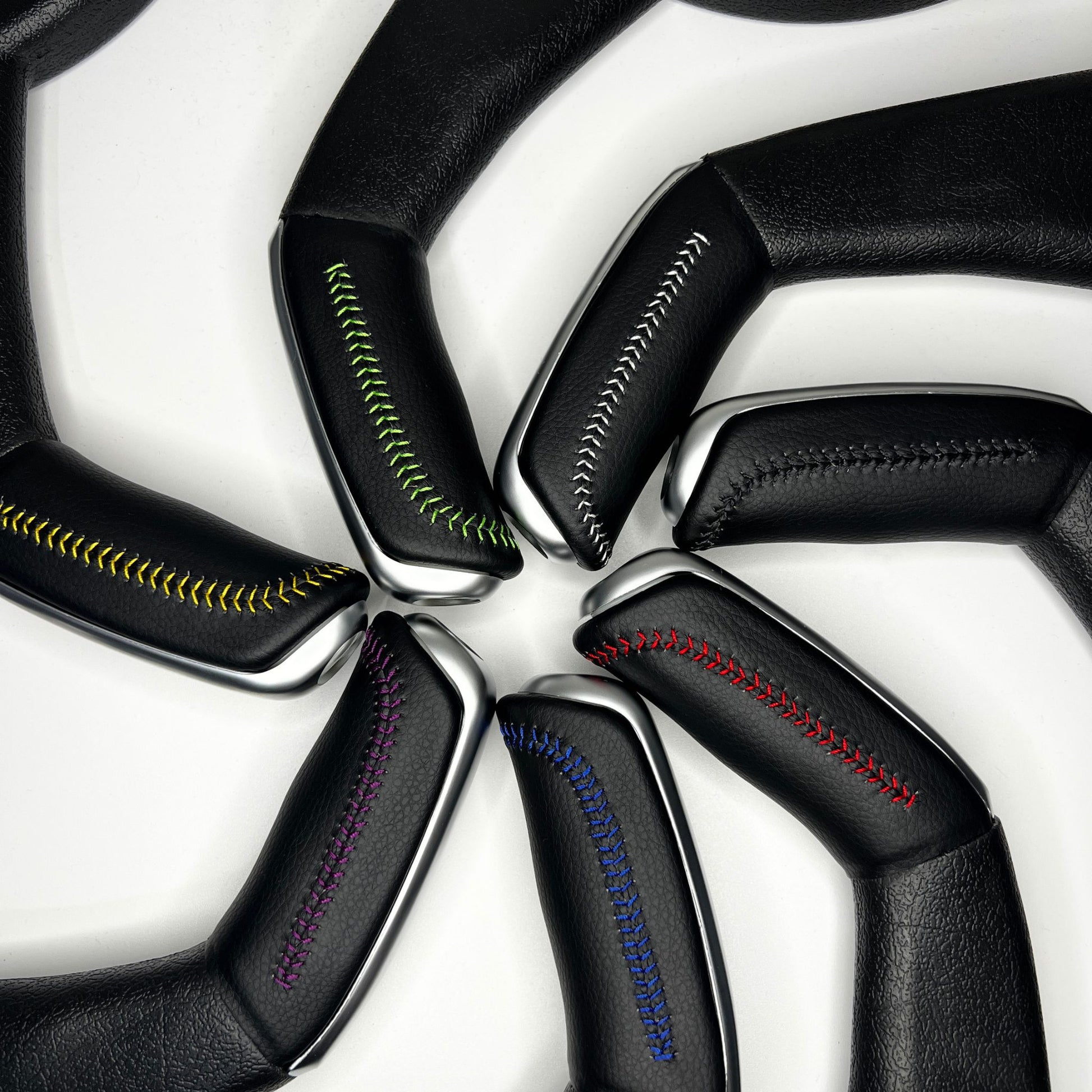 handbrake covers for commodores shown in various colour stitching
