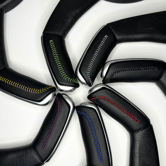 handbrake covers for commodores shown in various colour stitching